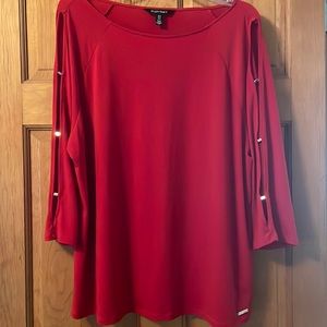 Vibrant red three-quarter slit sleeves with gold closures blouse.